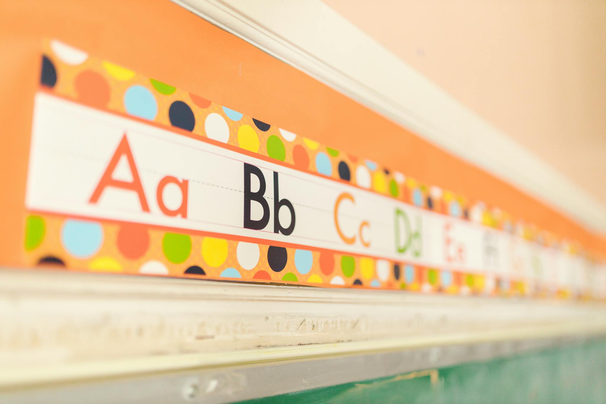 Bright and vibrant alphabet letters on a school classroom wall, perfect for early education themes.